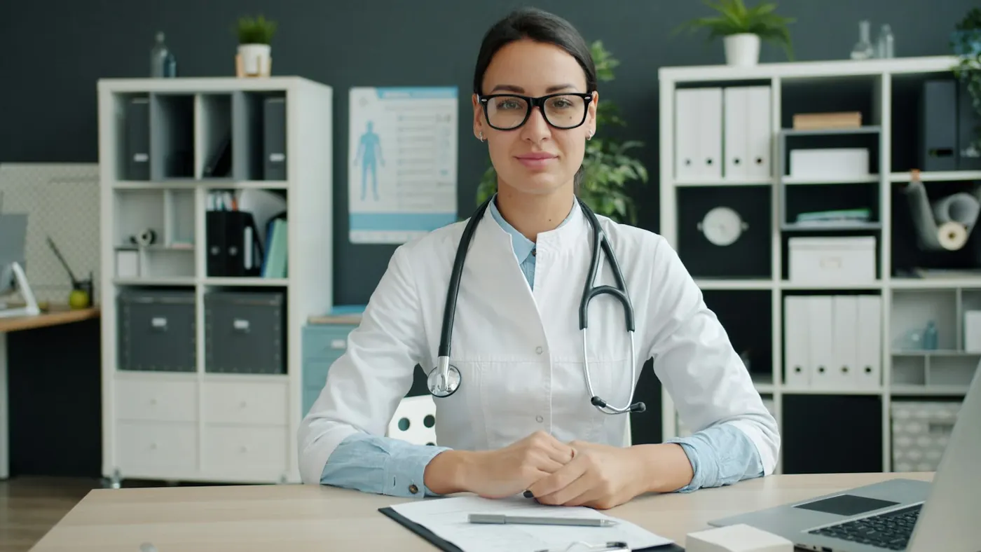 A doctor at her desk