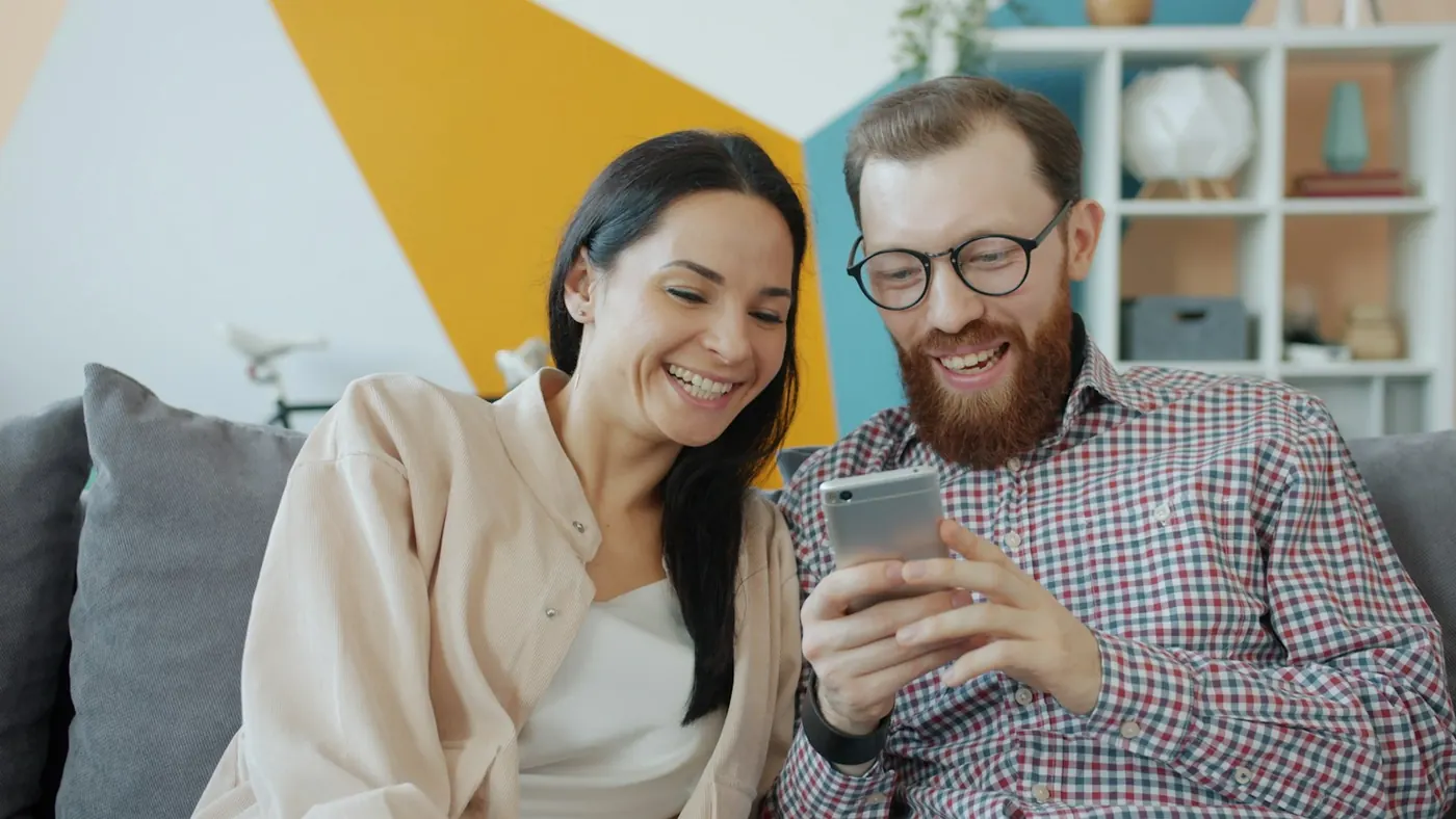 A couple looking at a phone together