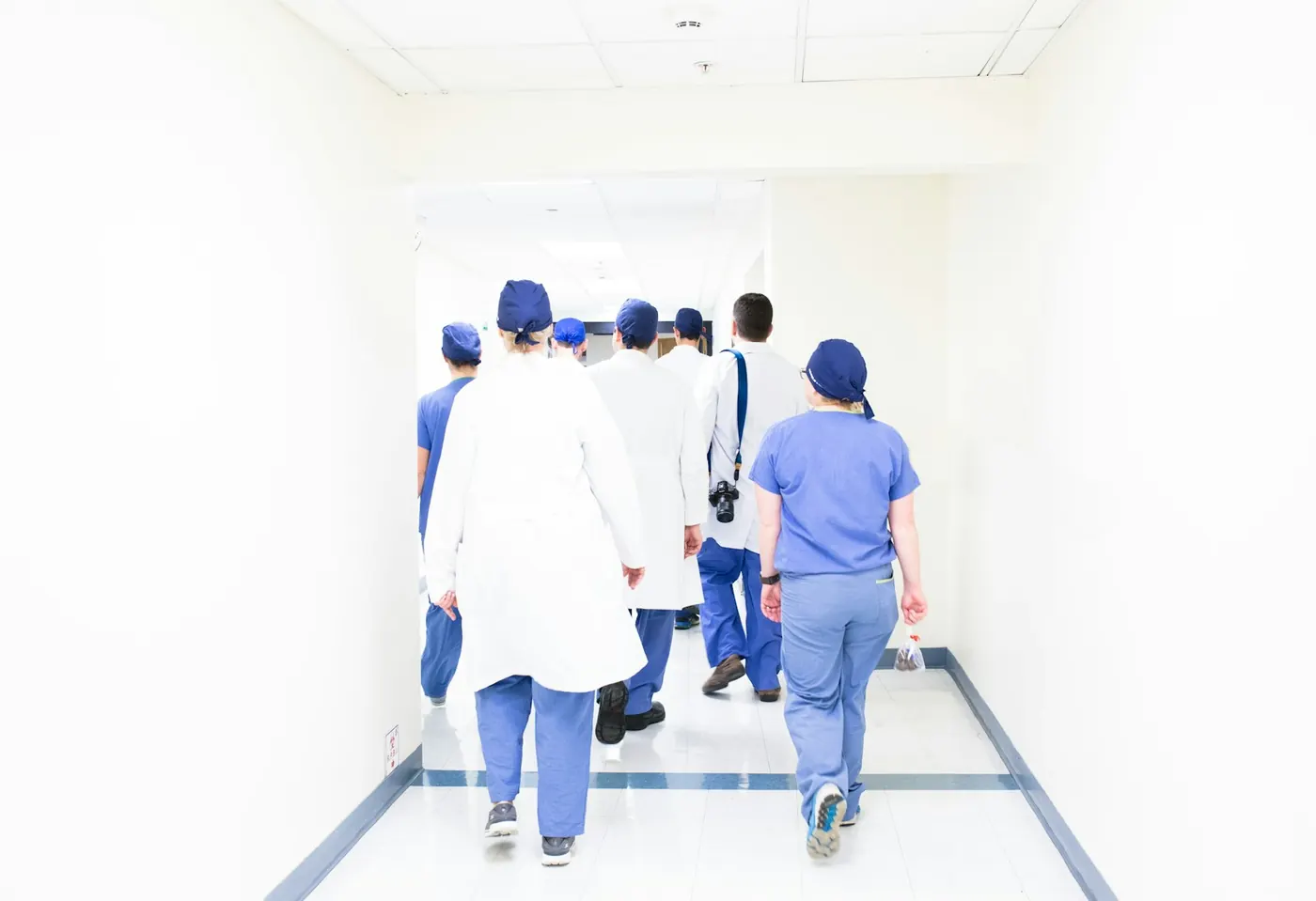 A care team walking down a hospital corridor